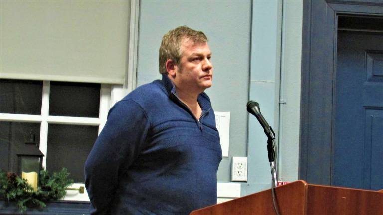 Ann Genader photo James Aiello, owner of Greenwood Lake Discount Liquors, tells the Township of West Milford Council the liquor distribution license they approved Wednesday will put him and other small business owners with consumption licenses out of business.