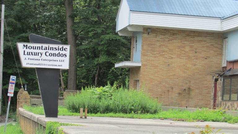 PHOTO BY ANN GENADER Luxury condos will replace the former motel at 165 Lakeside Road in Hewitt.