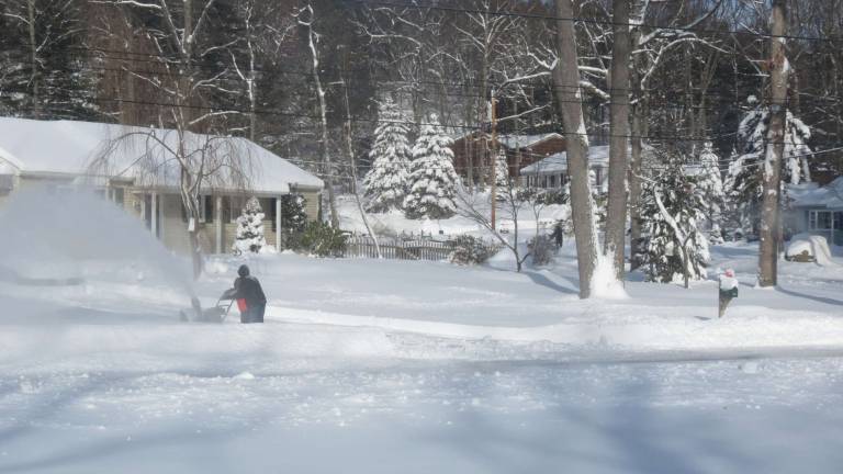 Photo by Patricia Keller West Milford residents were snowblowing there way out from under Nemo last Saturday.