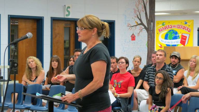 Photo by Patricia Keller Heather Vandeweert addressed the school board Tuesday night with lots of support from other parents of children with special needs.