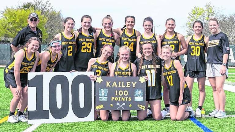 LAX2 The West Milford High School girls lacrosse team celebrates Kailey Maskerines scoring 100 points. (Photo courtesy of Frank R. Galella III)