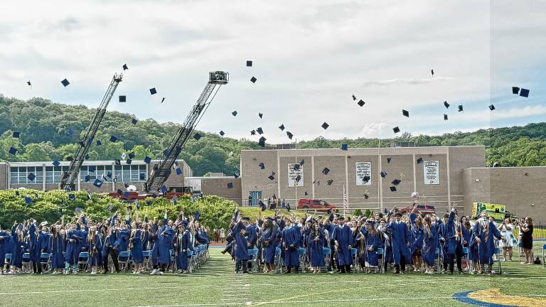 The Jefferson Township High School graduates toss their caps in the air at the end of the ceremony Friday, June 20. (Photos by Denise von Wilke)