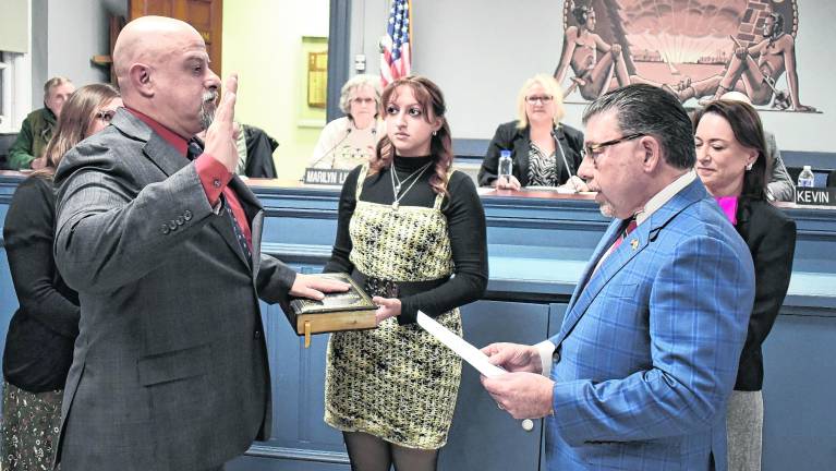 Rudy Hass, left, with his daughter holding the Bible, is sworn in to the West Milford Township Council at its public meeting on Wednesday, Jan. 7, by Senator Anthony Bucco (LD-25), who was joined by Assemblywoman Aura Dunn (LD-25).