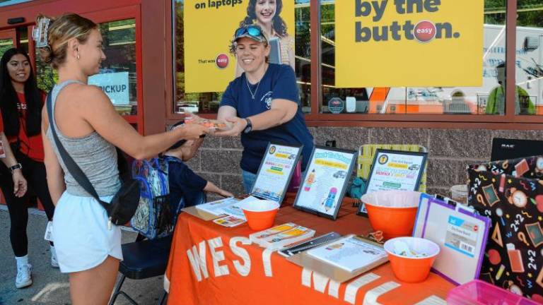 The West Milford First Aid Squad collects donated school supplies Aug. 9 at the Staples in Riverdale. (Photo provided)