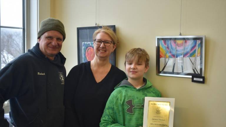 Nathan Niskayuna, 10, poses with his artwork and recognition certificate and his parents, Dan and Stacey. (Photos by Rich Adamonis)