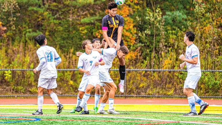HI1 Julian Pierre goes to hit the ball in the Passaic County Tournament quarterfinal game against Wayne Valley on Saturday, Oct. 11. The Highlanders lost, 2-0. (Photos by TJ Nolan)