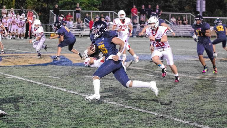Jefferson ball carrier Braedan Cummings on the run in the game against Whippany Park at home Friday, Sept. 26. Jefferson won, 48-26, and Cummings made one touchdown. (Photos by George Leroy Hunter)