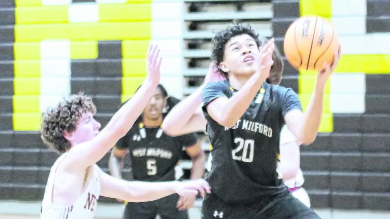 West Milford's Josh Moreno (20) leaps during a shot. Moreno scored 16 points.