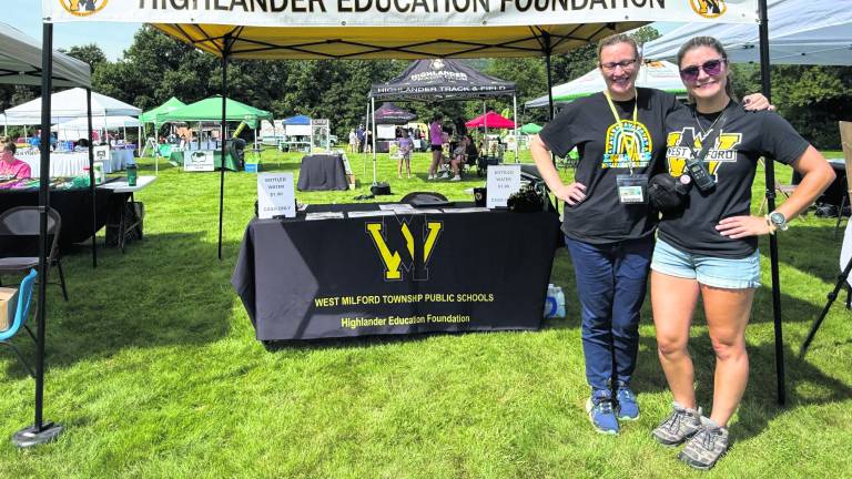 Lisa Johnson, volunteer, and Marisa Gough pose for a photo.