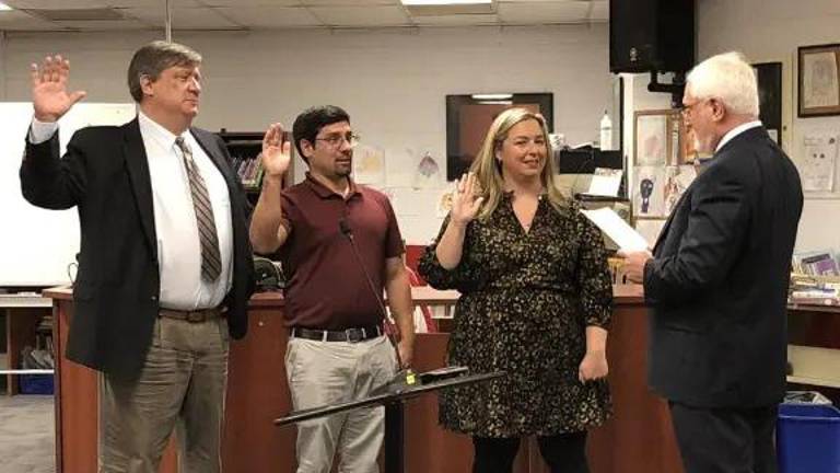 From left, Peter Lippe, William Cytowicz and Tara Racano are sworn in to three-year terms on the West Milford Board of Education by board attorney Andrew Brown at the reorganization meeting Jan. 3, 2023. (File photo by Kathy Shwiff)