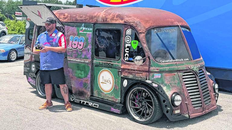 L.J. Koch stands in front of the Luca food truck.