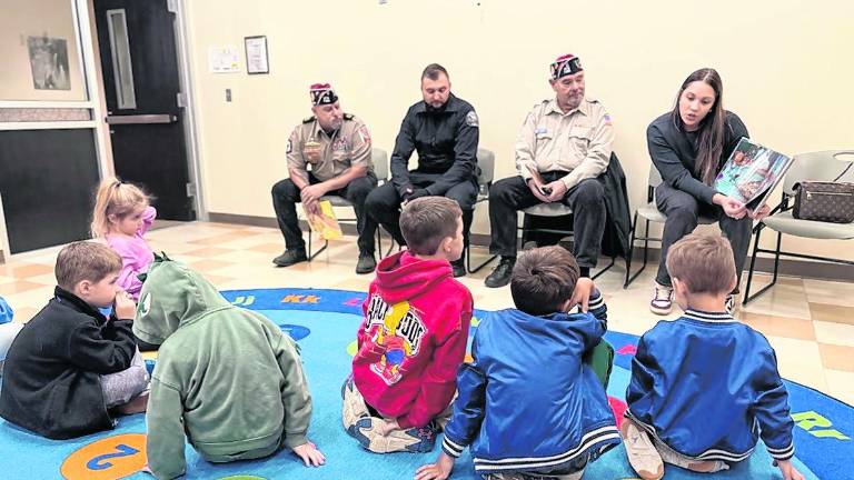 Rudy Hass, David Borowski, Marine and West Milford policeman; John Trojanowski, Army; Kalyan Autie, mother of Ezekiel and Enzo, and wife of a VFW member talk to children.