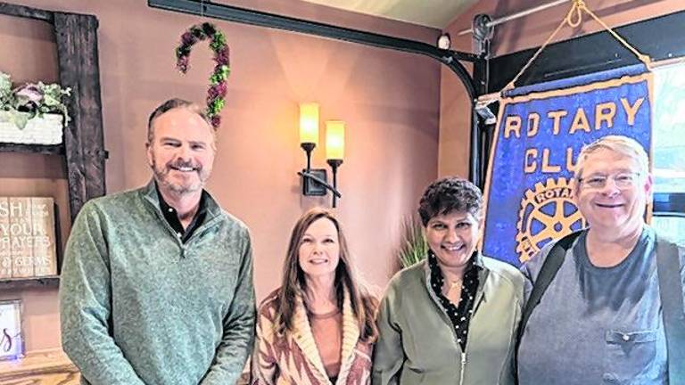 From left, Tom Ziegenbalt stands with recently inducted memers Christine Vanderploeg and Sue Siva, and sponsor Mark Fredericks.