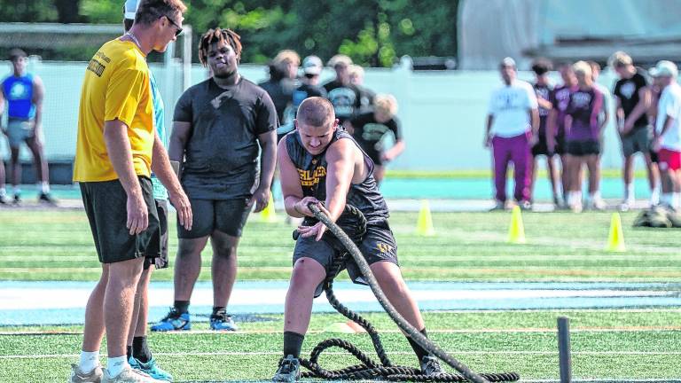 Ryder Decker performs the sled pull.