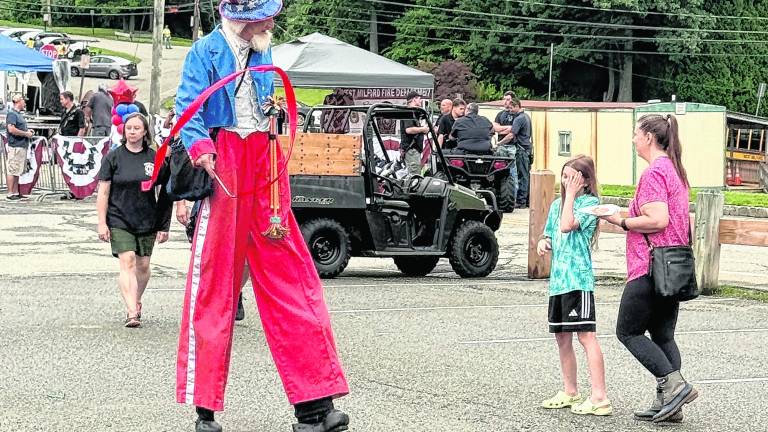 Uncle Sam performs on stilts.