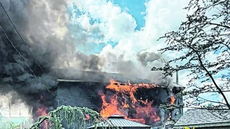 A structure fire burns at 2 Louis Ave.