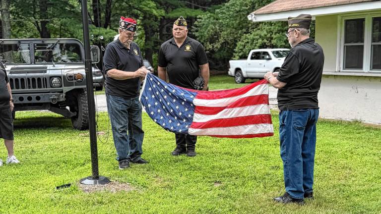 Members of the West Milford Veterans of Foreign Wars Post 7198 conduct a flag retirement ceremony July 12 at their building at Melody Lake on Cahill Cross and Ridge roads. (Photos provided)