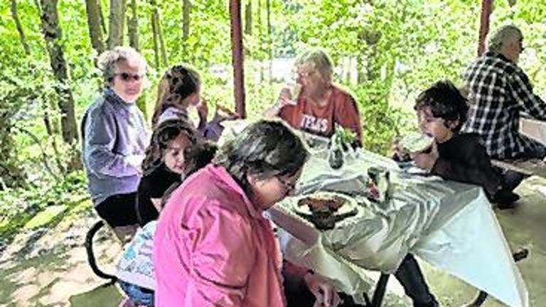West Milford councilwoman Marilyn Kichtenberg sits with particpants.