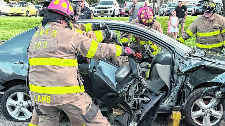 Firefighters demonstrate a vehicle extraction.