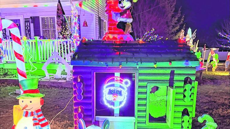 A snowman, Stitch, The Grinch and Mickey and Minnie Mouse are shown.