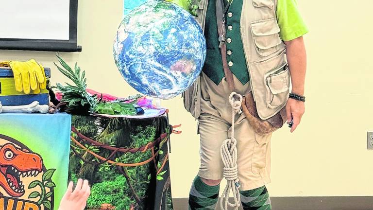 Professor Livingstone (David Engel) takes children on a dinosaur safari.