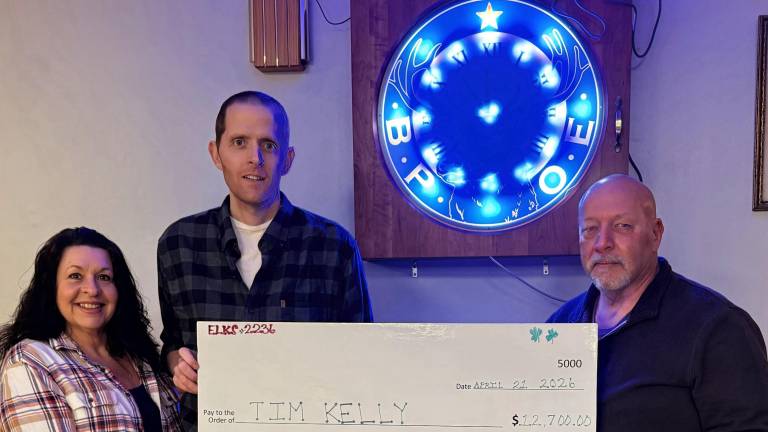 From left, Gina Mantz, fundraiser co-chair, Tim Kelley, Rich Otis Asmus, fund raiser co-chair.