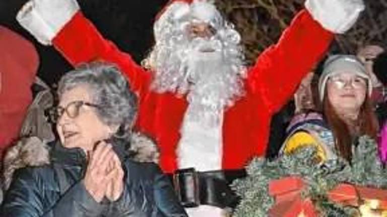 Santa Claus signals for the tree to be lit at last year’s tree lighting.