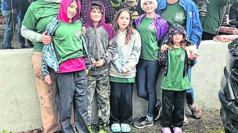Beautification Day volunteer moms Erin Colfax (far left) and Karen Muto, owner of DeMarco’s Pizzeria &amp; Restaurant, joined the cleanup and picnic with their children.