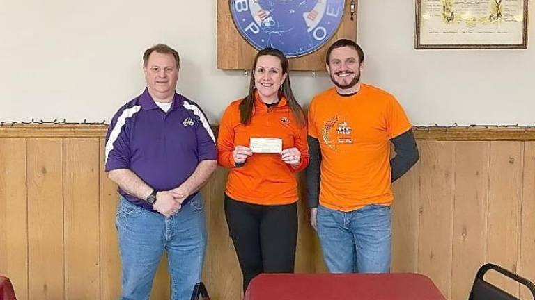 Kenneth Hensley, Exalted Ruler of West Milford Elks, handed a $2500 check to sister and brother Lyndsay and Chris Wright for the National Multiple Sclerosis