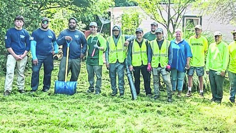 Landscaping professionals join forces to restore grounds at domestic violence shelter